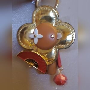 Gold and Brown Flower Character Bagcharm
